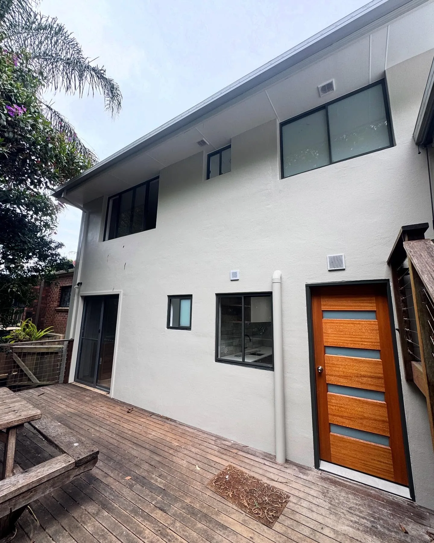 The same exterior wall after a clean white recoat